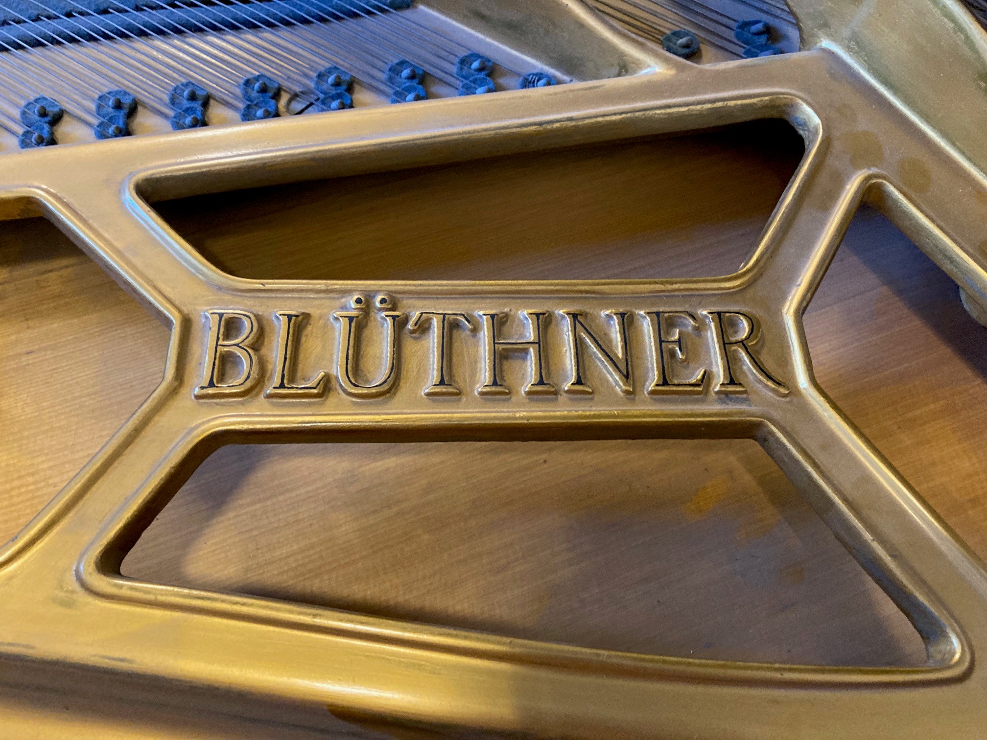 A BLUTHNER BABY GRAND PIANO Image