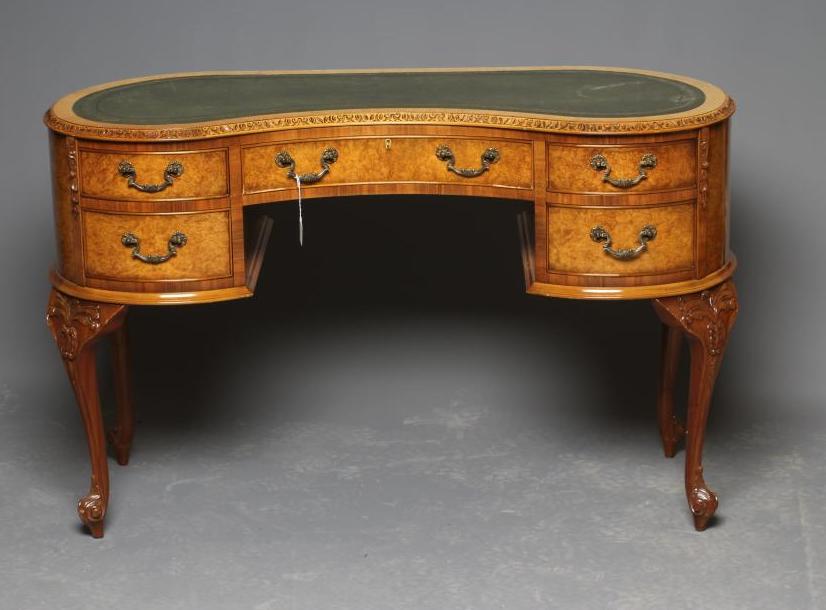 A CARVED BURR WALNUT KIDNEY SHAPED DESK Image