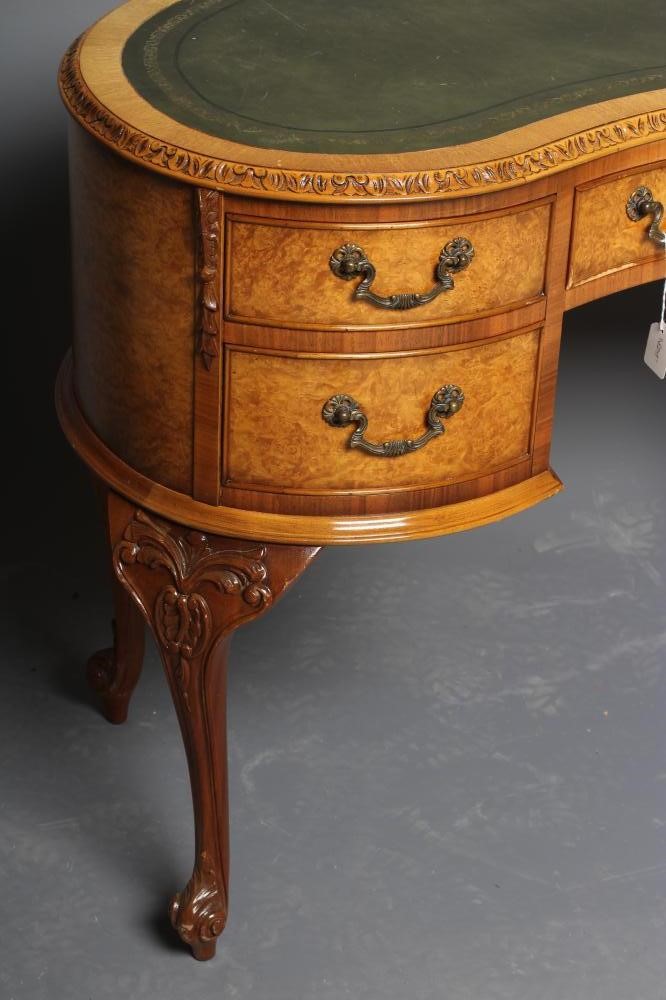 A CARVED BURR WALNUT KIDNEY SHAPED DESK Image