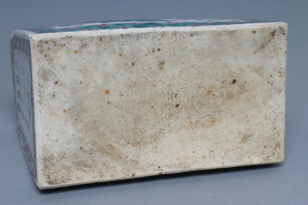 A CANTONESE PORCELAIN FAMILLE ROSE PILLOW of domed oblong form with one quatrefoil pierced end Image