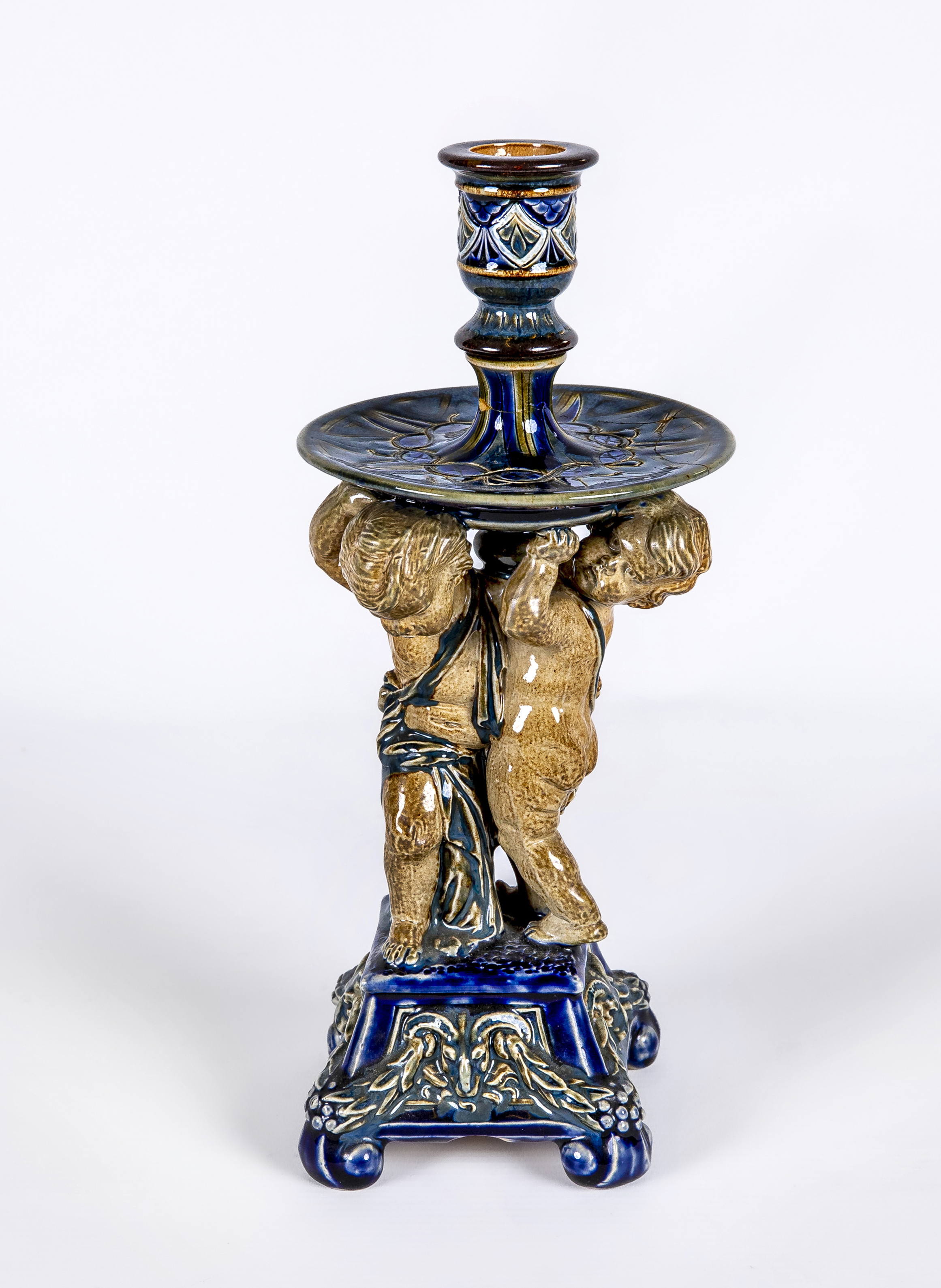A STONEWARE FIGURAL CANDLESTICK Image