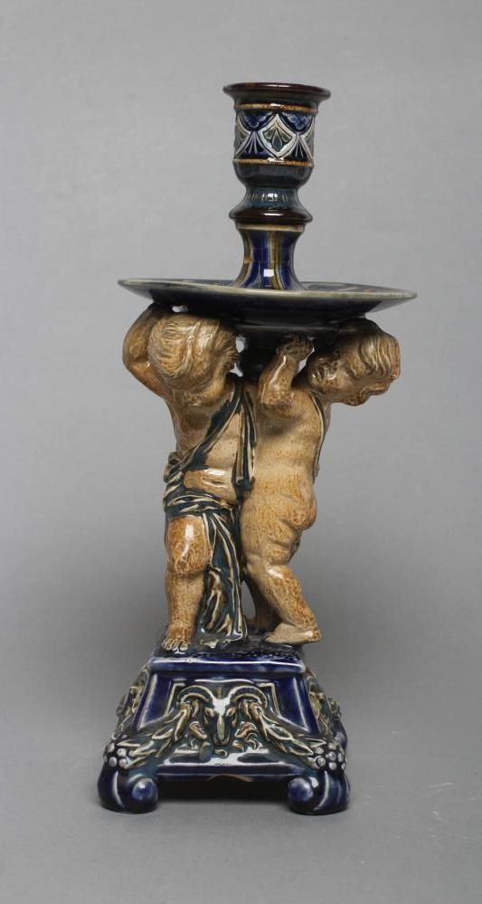 A STONEWARE FIGURAL CANDLESTICK Image