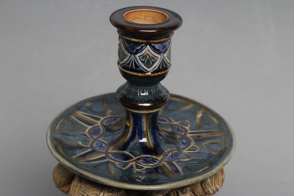 A STONEWARE FIGURAL CANDLESTICK Image