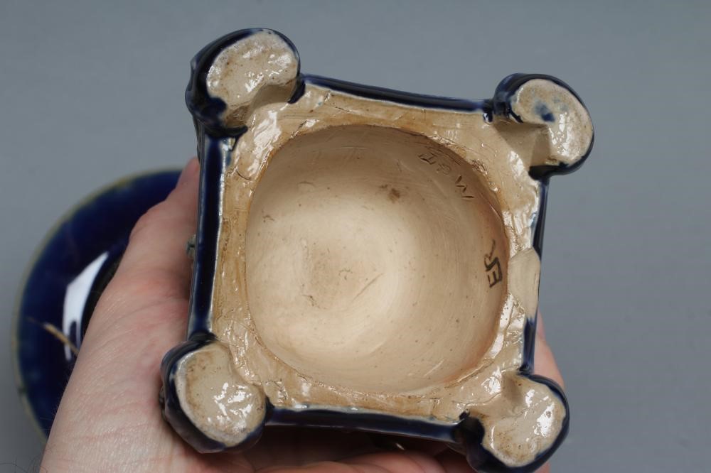 A STONEWARE FIGURAL CANDLESTICK Image