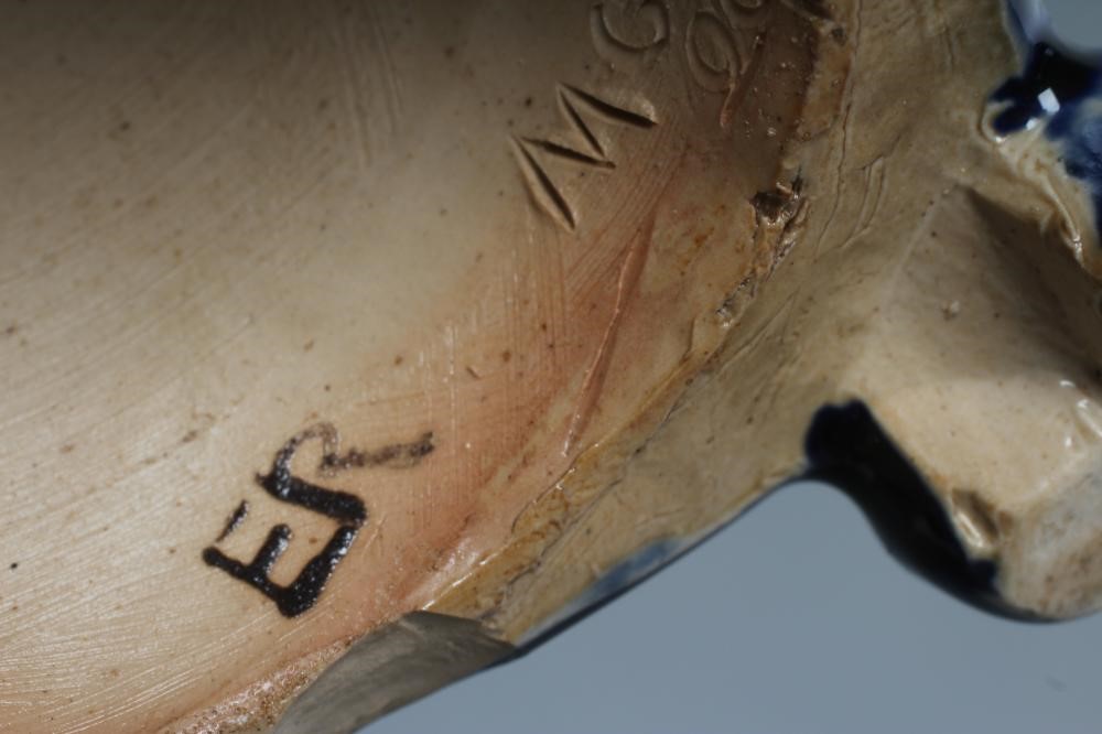 A STONEWARE FIGURAL CANDLESTICK Image