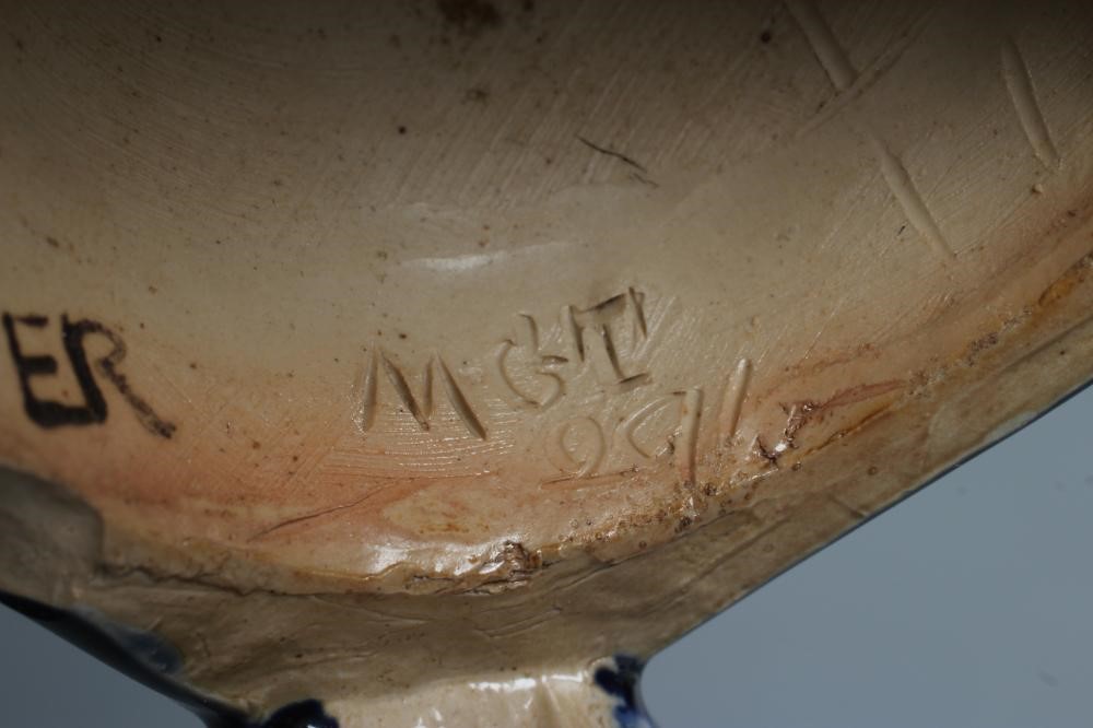 A STONEWARE FIGURAL CANDLESTICK Image