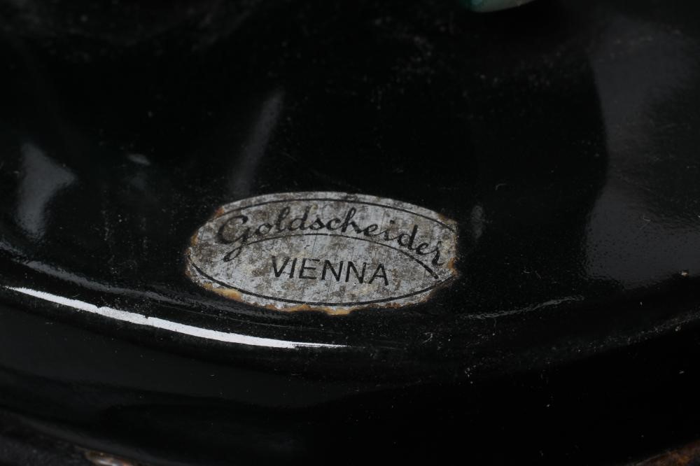 AN ART DECO GOLDSCHEIDER EARTHENWARE FIGURE modelled as a young fashionable lady wearing a wide Image