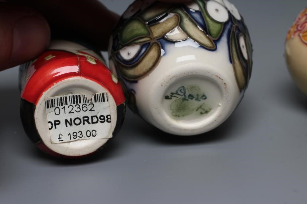 A COLLECTION OF THREE MINIATURE MOORCROFT POTTERY VASES Image