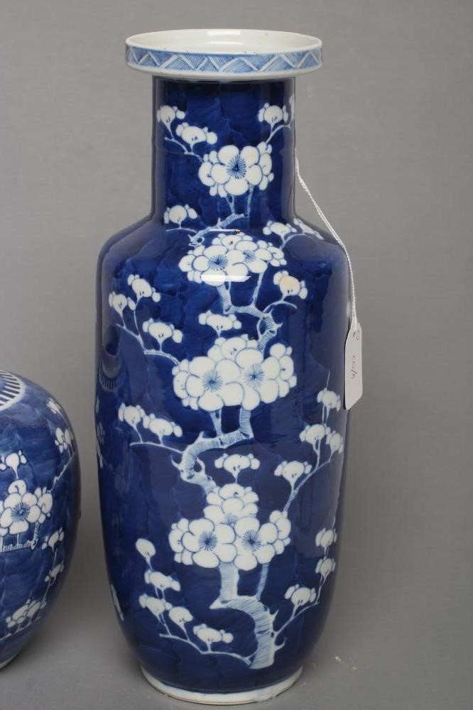 A CHINESE PORCELAIN ROULEAU VASE painted in underglaze blue with the Cracked Ice and Prunus pattern Image
