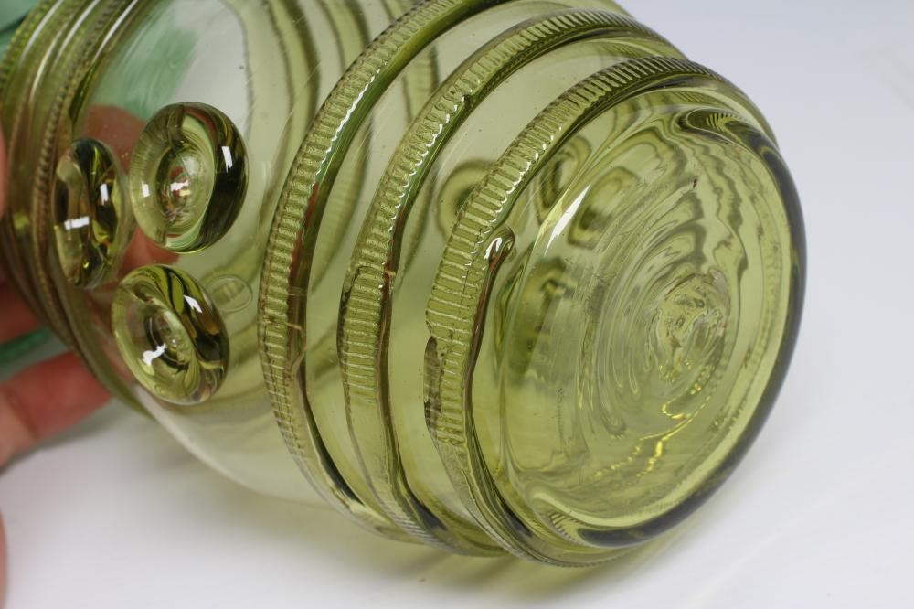 A GERMAN GREEN DAUMENGLAS OR THUMB GLASS AND COVER Image