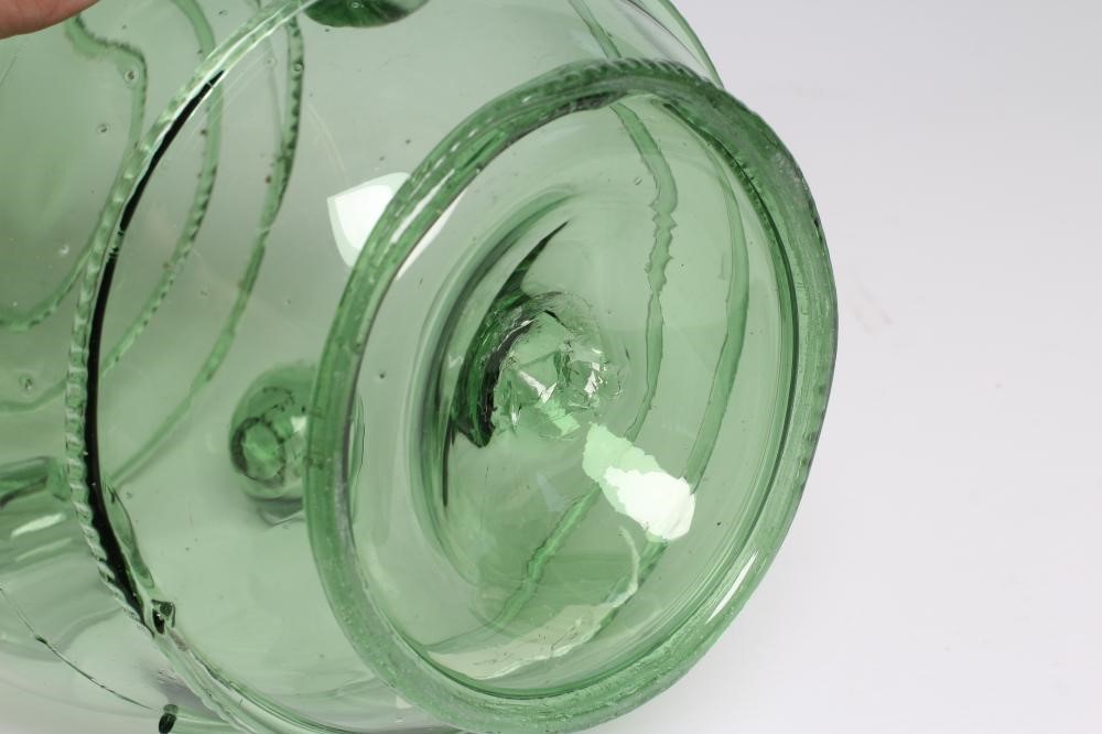 A GERMAN GREEN DAUMENGLAS OR THUMB GLASS AND COVER Image