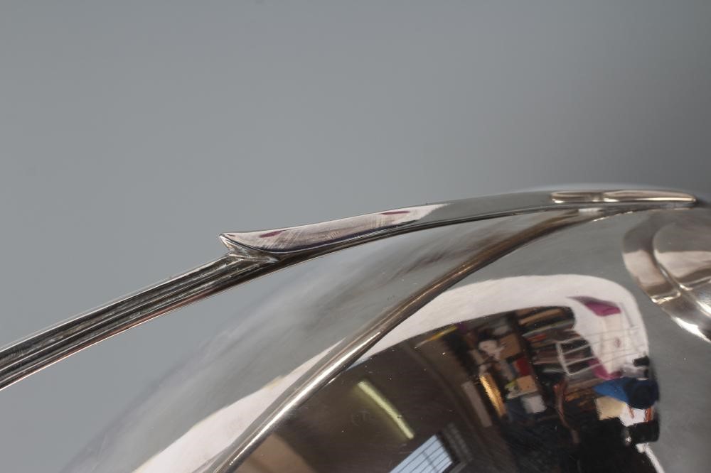 AN EPNS SOUP TUREEN AND COVER, early 20th century, of oval form with reeded loop handles on a swept Image