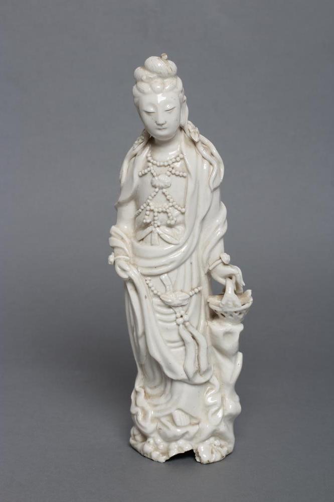A CHINESE BLANC DE CHINE PORCELAIN FIGURE modelled as a female deity wearing a beaded bodice Image