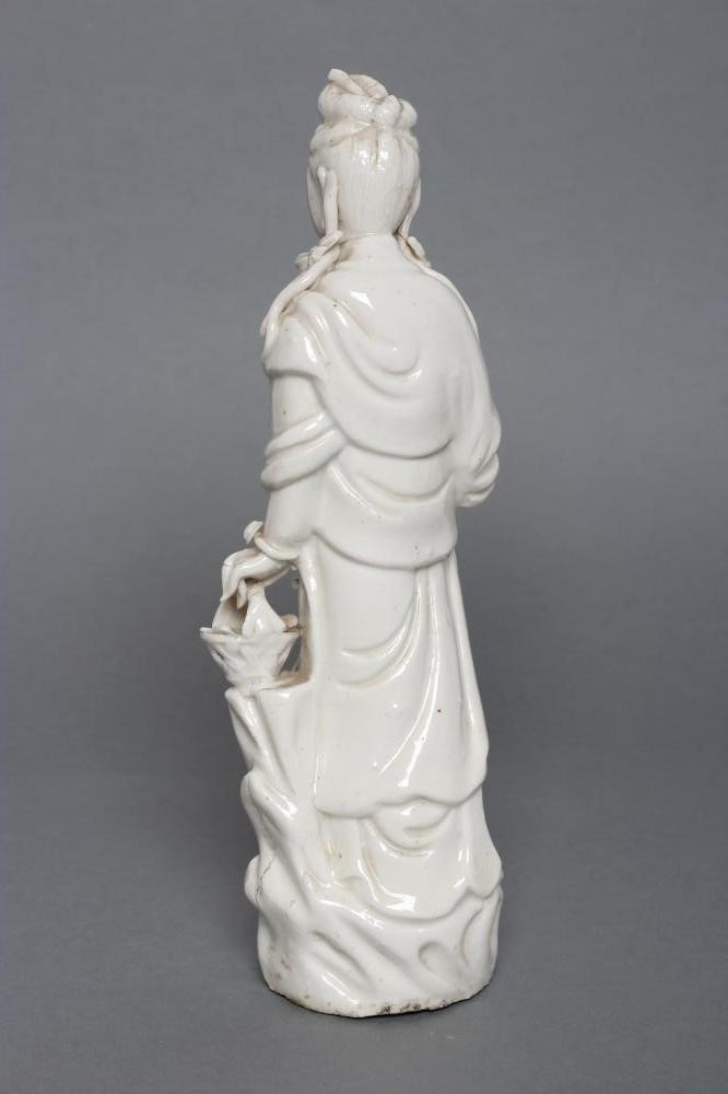 A CHINESE BLANC DE CHINE PORCELAIN FIGURE modelled as a female deity wearing a beaded bodice Image