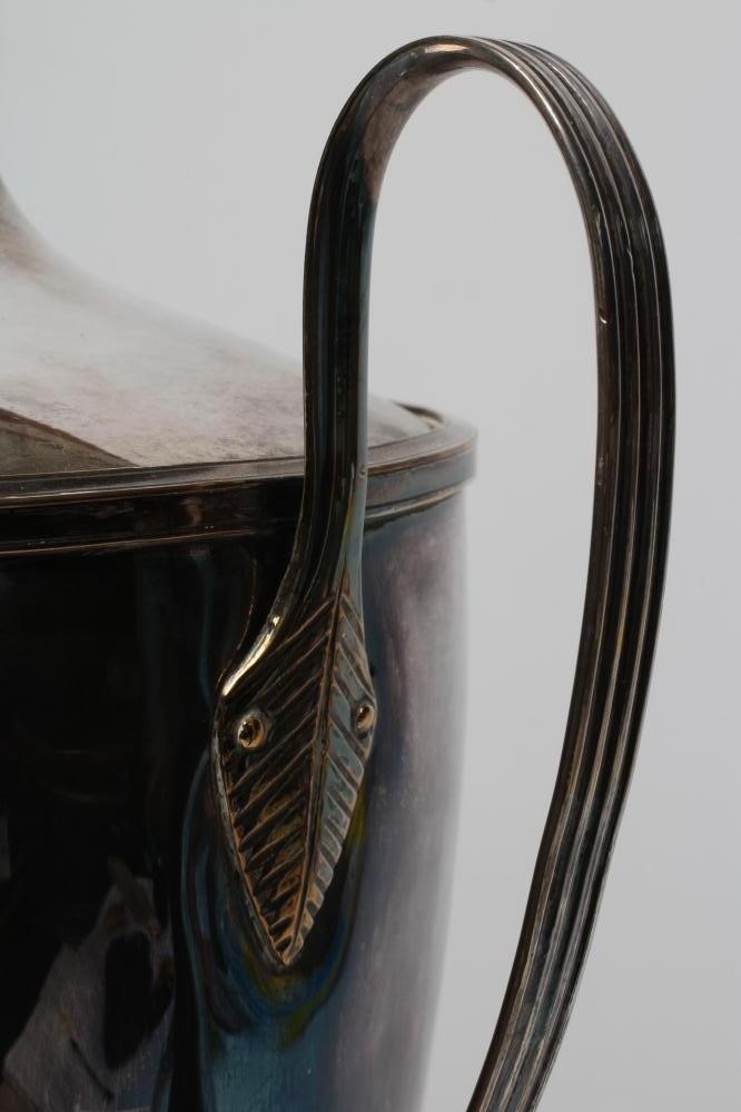 A REGENCY PLATED ON COPPER TEA URN with swept lift-off cover Image