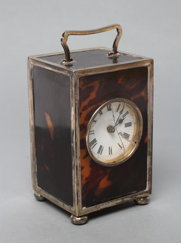 A SILVER MOUNTED TORTOISESHELL CARRIAGE CLOCK Image