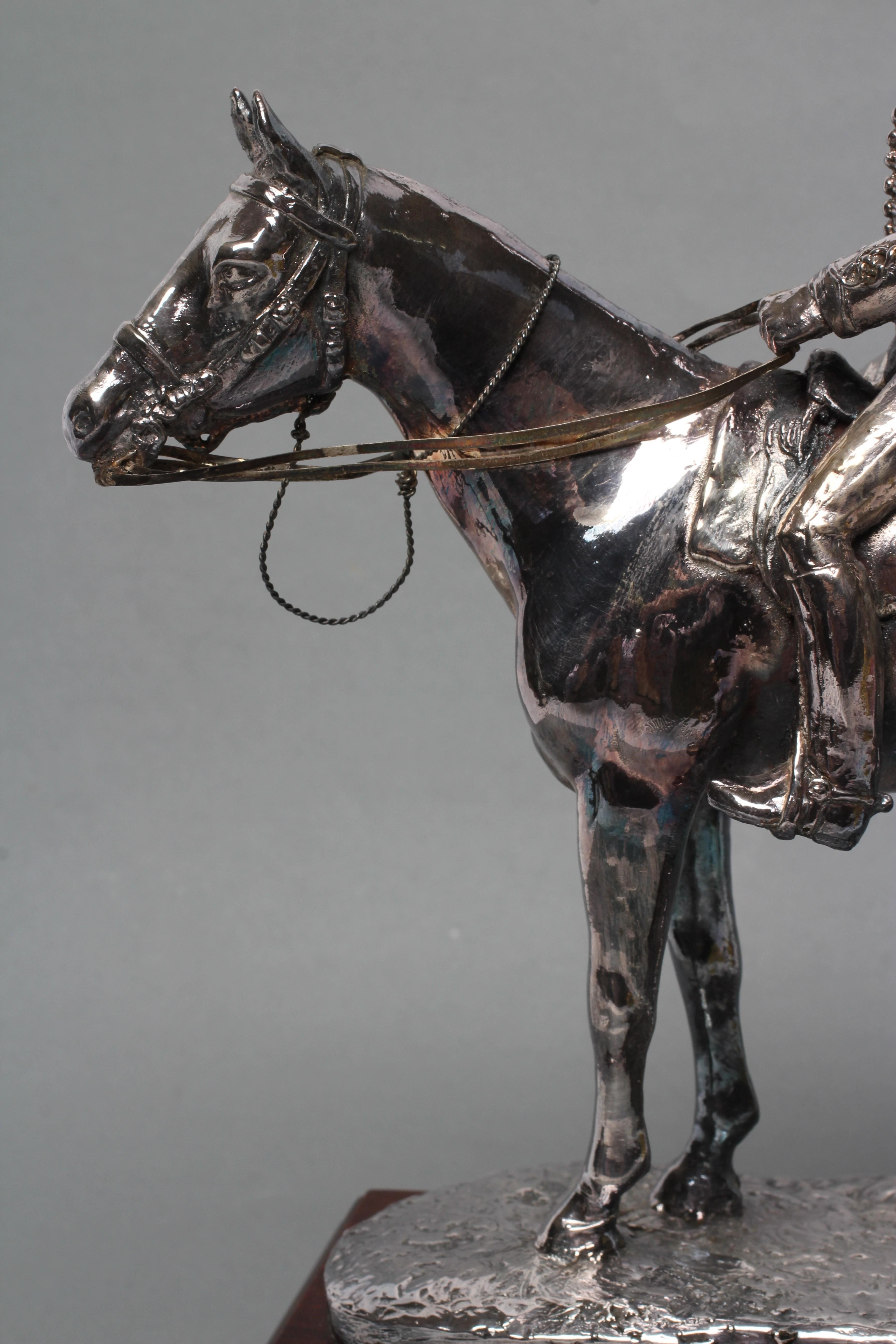 A FILLED SILVER EQUESTRIAN MODEL Image