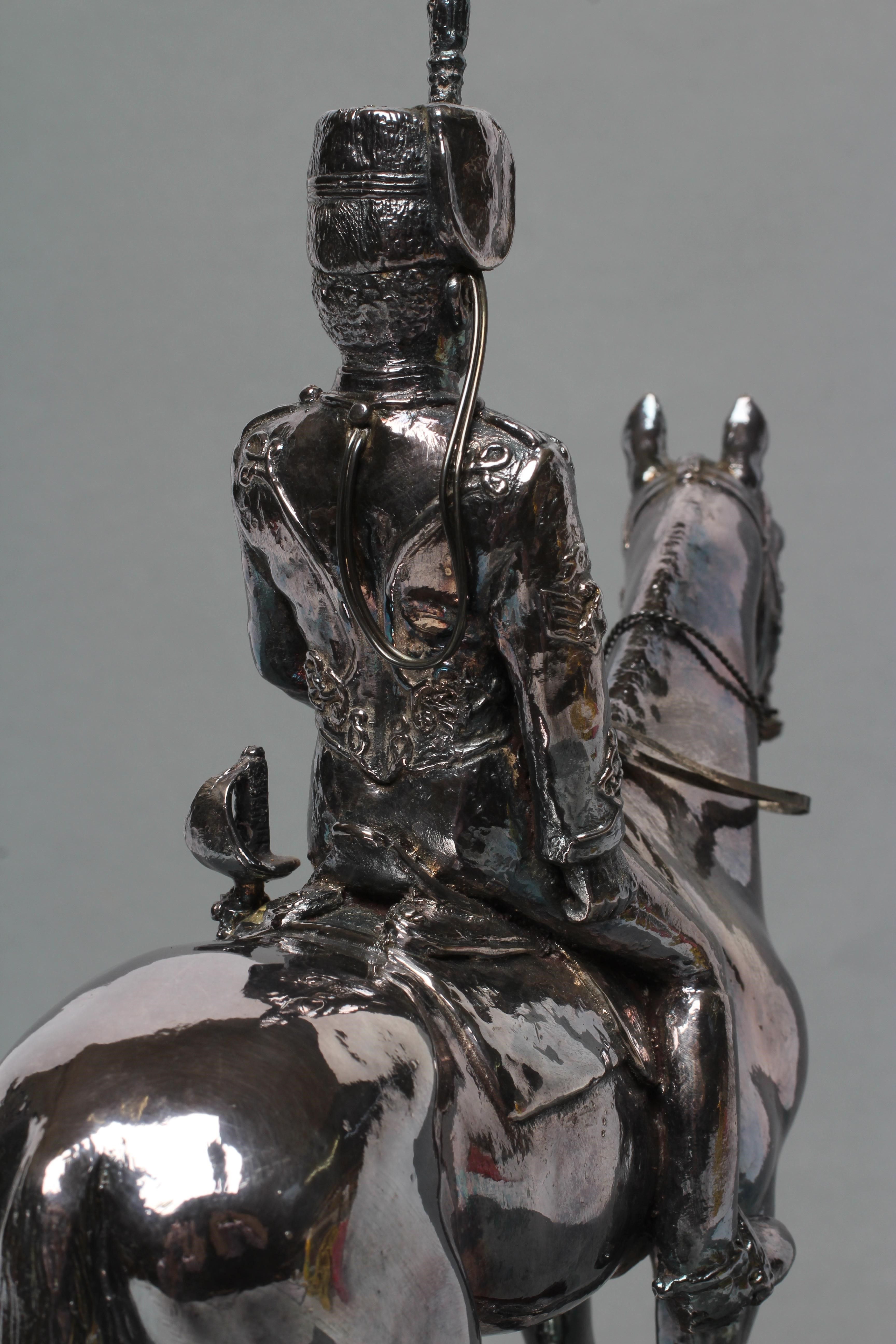 A FILLED SILVER EQUESTRIAN MODEL Image
