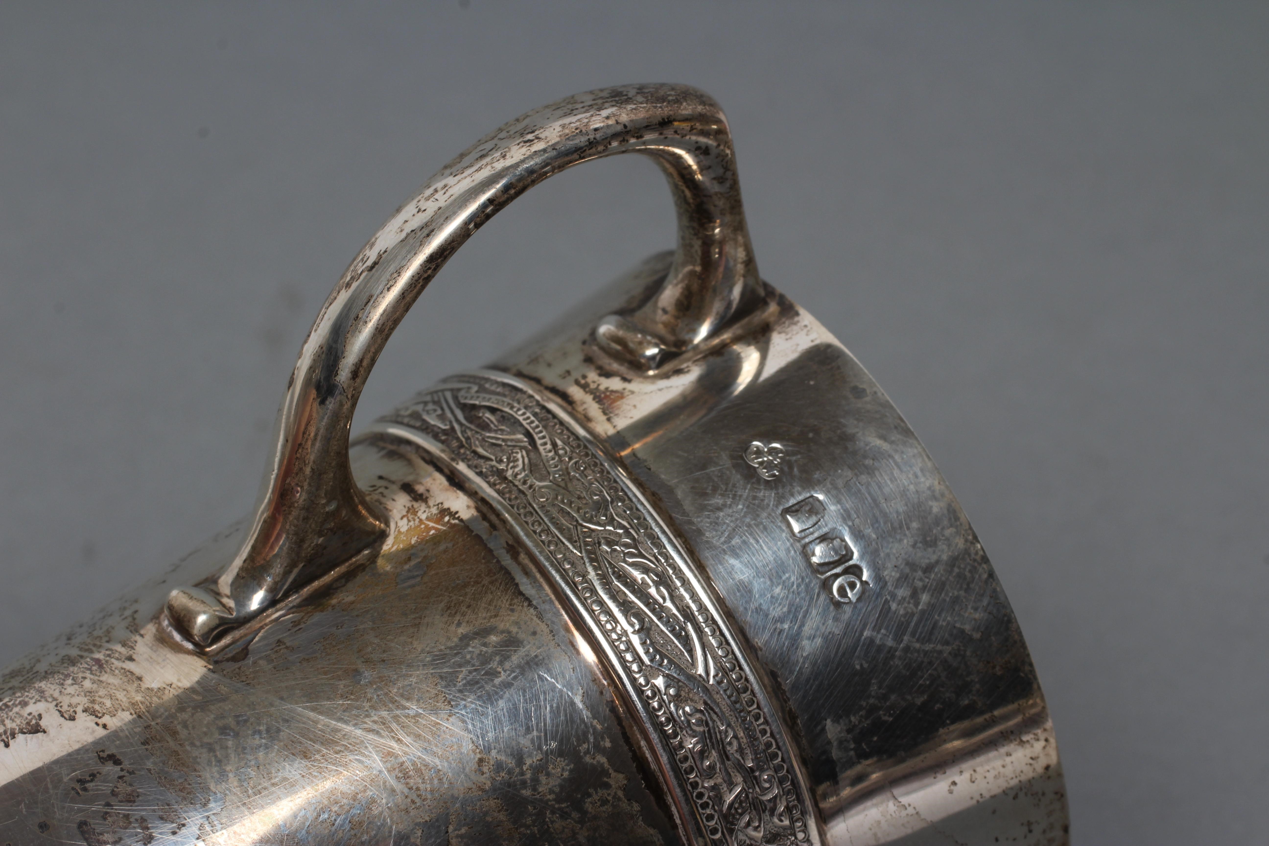 AN IRISH SILVER CHRISTENING MUG Image