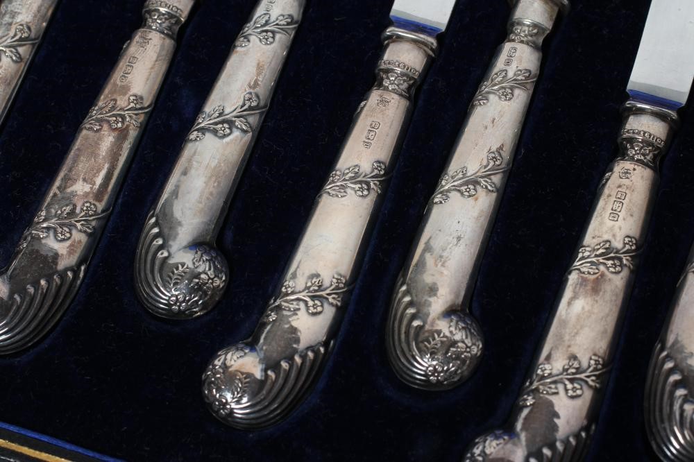 AN EDWARDIAN SET OF SIX PAIRS OF SILVER DESSERT KNIVES AND FORKS Image