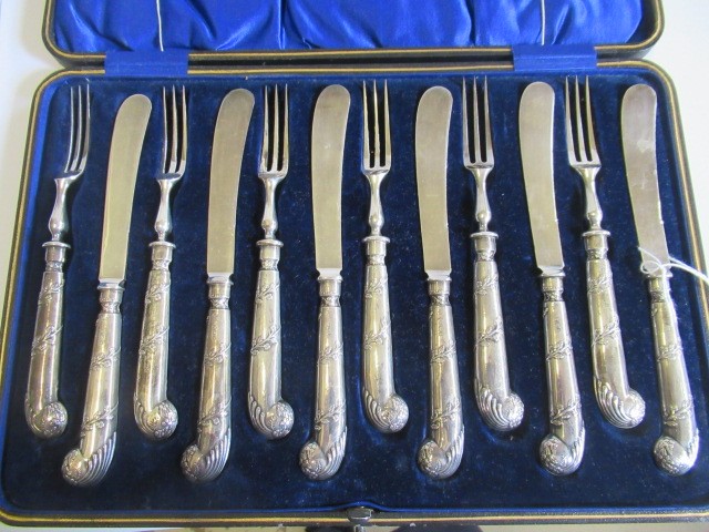 AN EDWARDIAN SET OF SIX PAIRS OF SILVER DESSERT KNIVES AND FORKS Image