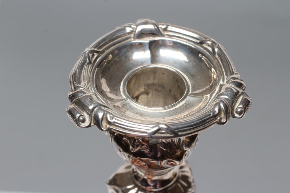 A PAIR OF LATE VICTORIAN SILVER CANDLESTICKS Image