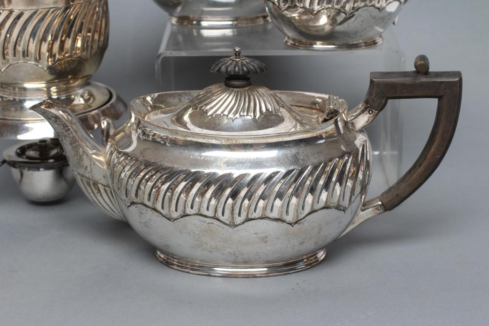 A LATE VICTORIAN SILVER FOUR PIECE TEA SERVICE Image