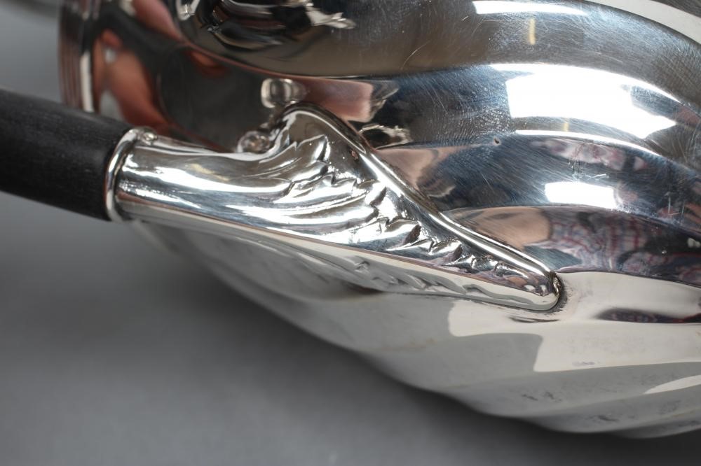 A LATE VICTORIAN SILVER CLARET JUG Image