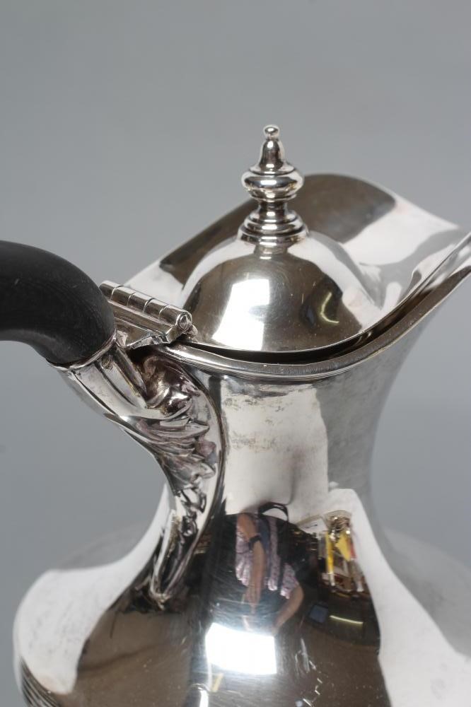 A LATE VICTORIAN SILVER CLARET JUG Image