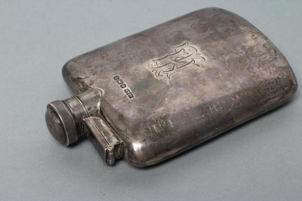 A LATE VICTORIAN SILVER HIP FLASK Image