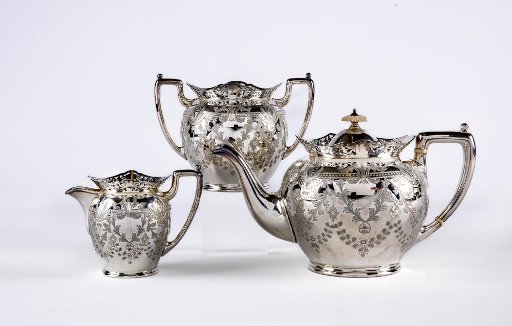 A LATE VICTORIAN SILVER THREE PIECE TEA SERVICE Image