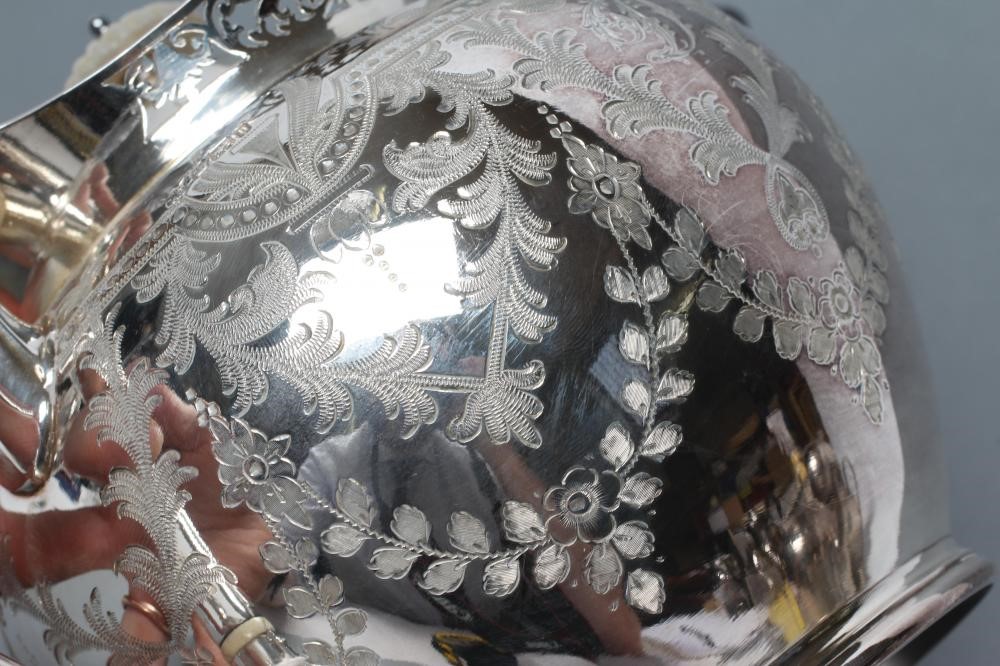 A LATE VICTORIAN SILVER THREE PIECE TEA SERVICE Image