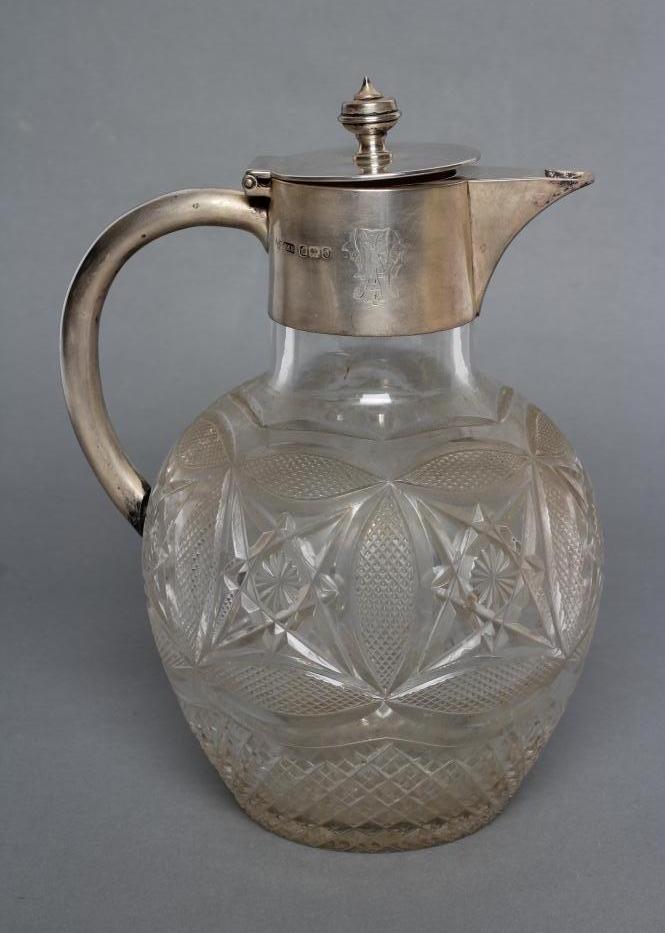A LATE VICTORIAN SILVER MOUNTED GLASS CLARET JUG Image