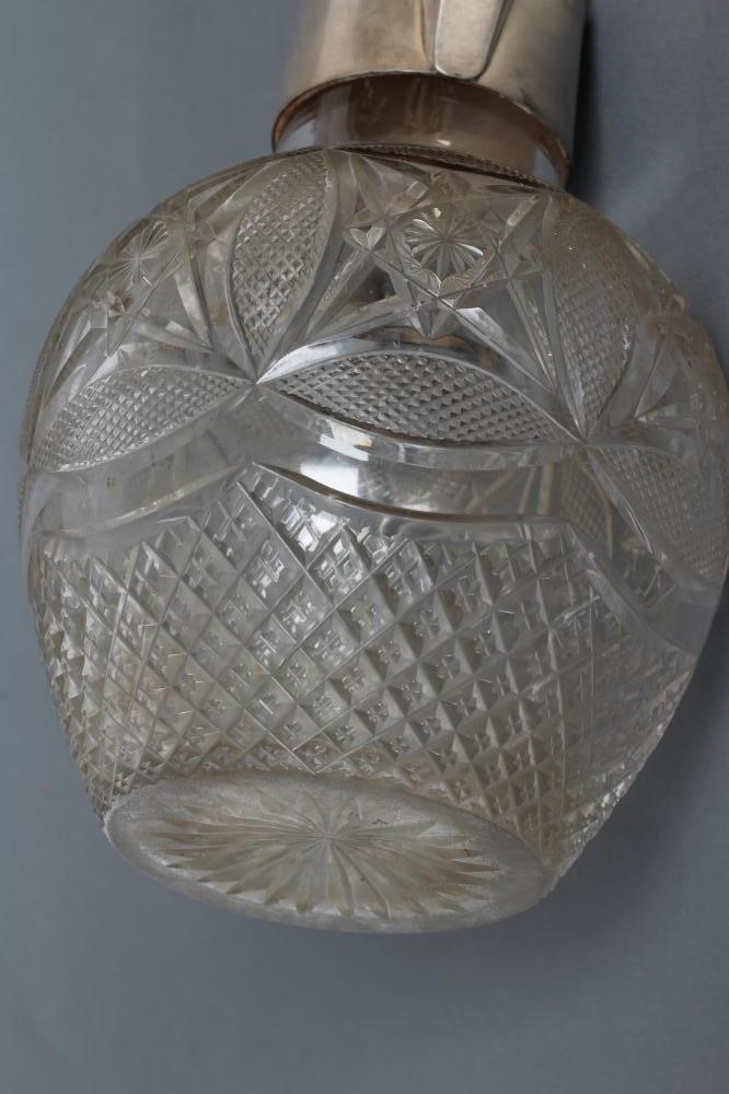 A LATE VICTORIAN SILVER MOUNTED GLASS CLARET JUG Image