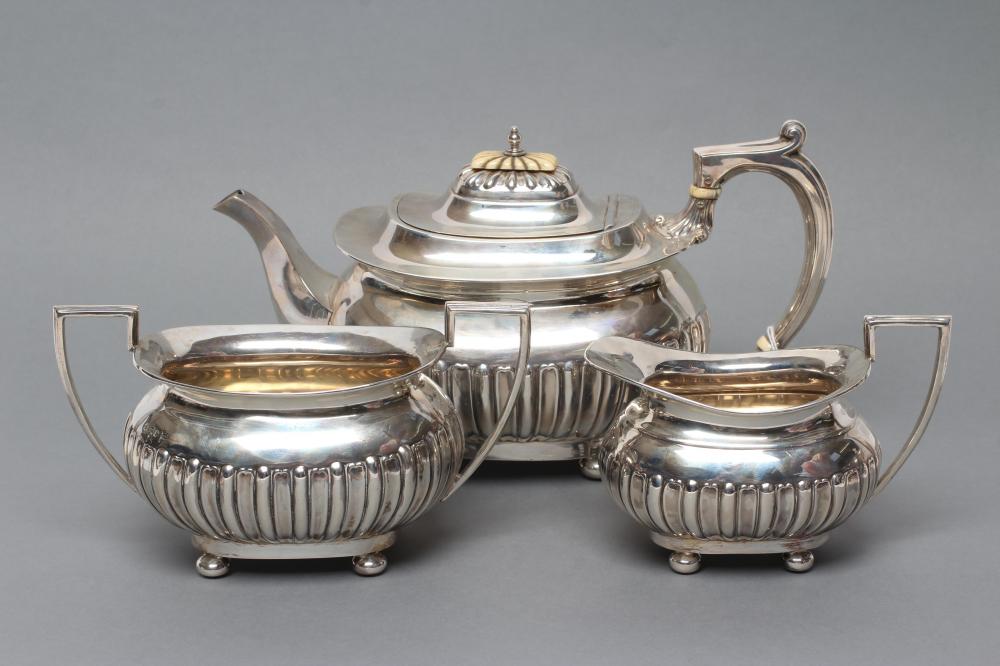 A LATE VICTORIAN SILVER THREE PIECE TEA SERVICE Image