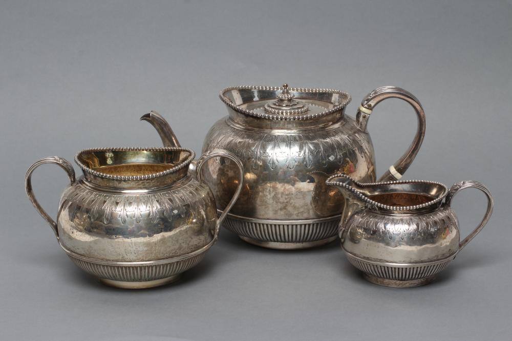 A MID VICTORIAN SILVER THREE PIECE TEA SERVICE Image