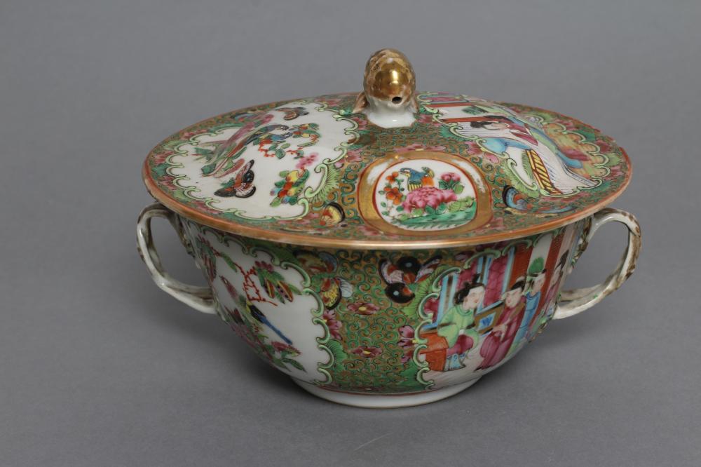 A CANTONESE PORCELAIN ECUELLE AND COVER of circular form with two entwined handles Image