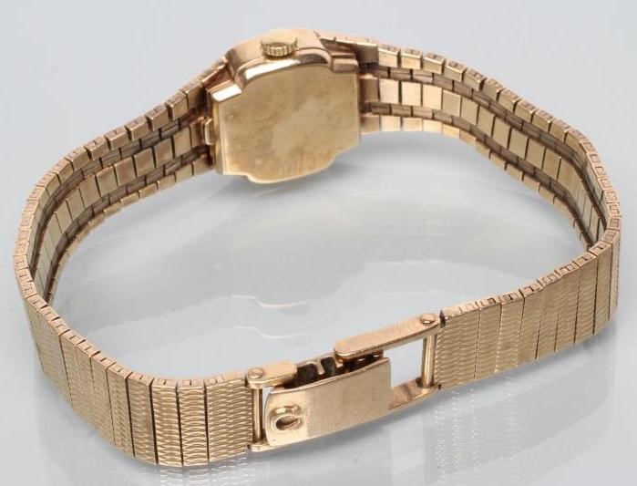 A LADY'S 9CT GOLD OMEGA WRISTWATCH Image