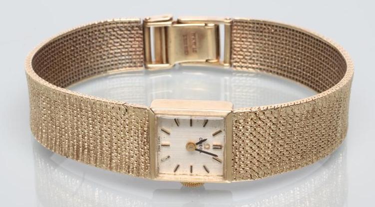 A LADY'S 9CT GOLD OMEGA WRISTWATCH Image