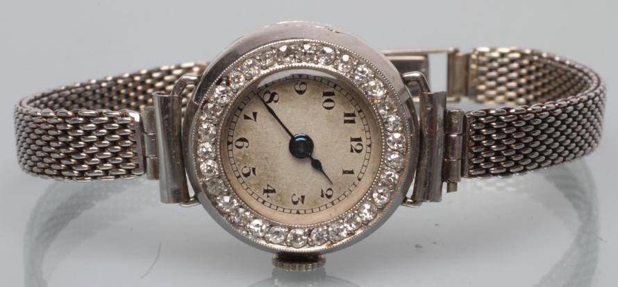 A DIAMOND AND PLATINUM COCKTAIL WATCH Image