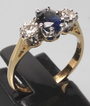 A SAPPHIRE AND DIAMOND THREE STONE RING Image