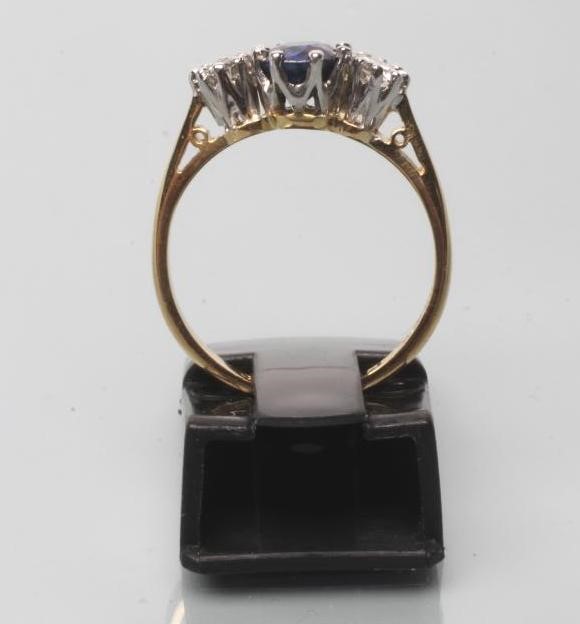 A SAPPHIRE AND DIAMOND THREE STONE RING Image
