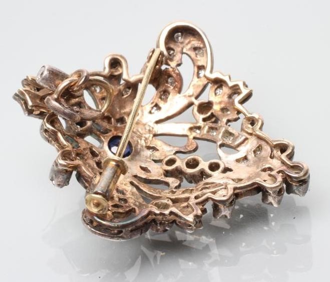 A VICTORIAN SAPPHIRE AND DIAMOND BROOCH/PENDANT of stylised anthemion form Image