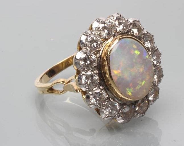 AN OPAL AND DIAMOND CLUSTER DRESS RING Image