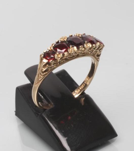 A FIVE STONE GARNET RING Image