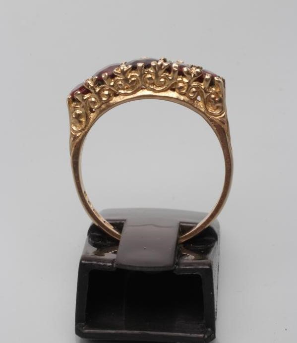 A FIVE STONE GARNET RING Image