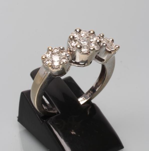 A DIAMOND TRIPLE CLUSTER RING Image