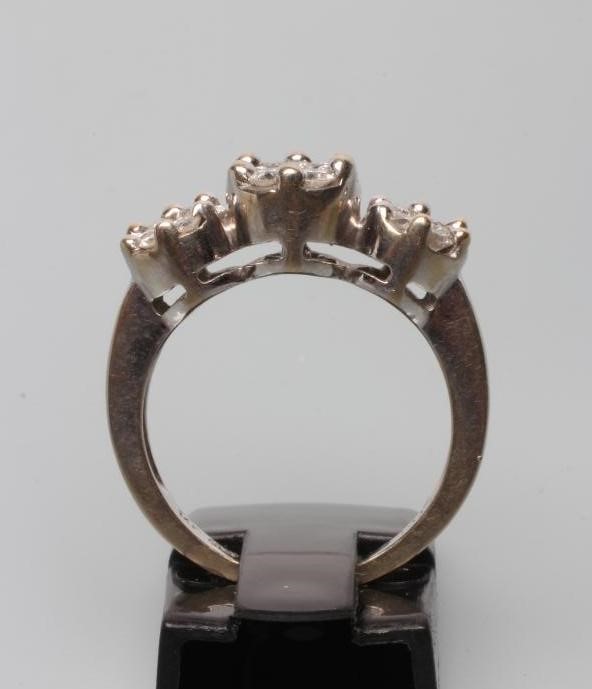 A DIAMOND TRIPLE CLUSTER RING Image