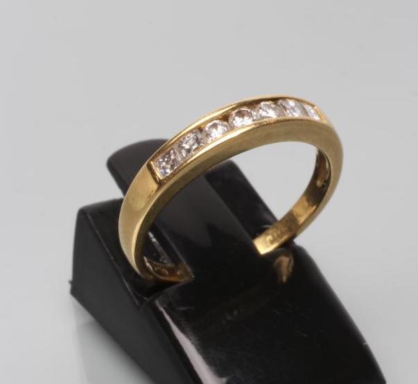 A SEVEN STONE DIAMOND HALF HOOP ETERNITY RING Image