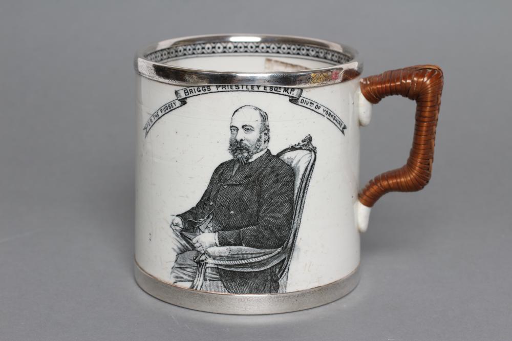 OF LOCAL LEEDS INTEREST - an Edwardian silver mounted earthenware mug of plain cylindrical form with Image